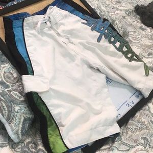Aeropostale board shorts in vivid blue, black and green on a white, 12” inseam.